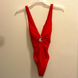 New condition only worn once, medium red one piece swim suit.